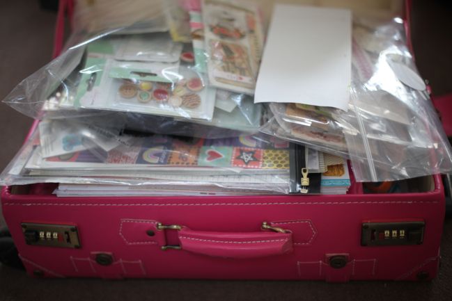 suitcase packed to scrapbook at a friend's house