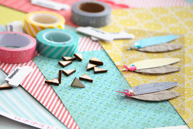 scrapbooking supplies and feather embellishments