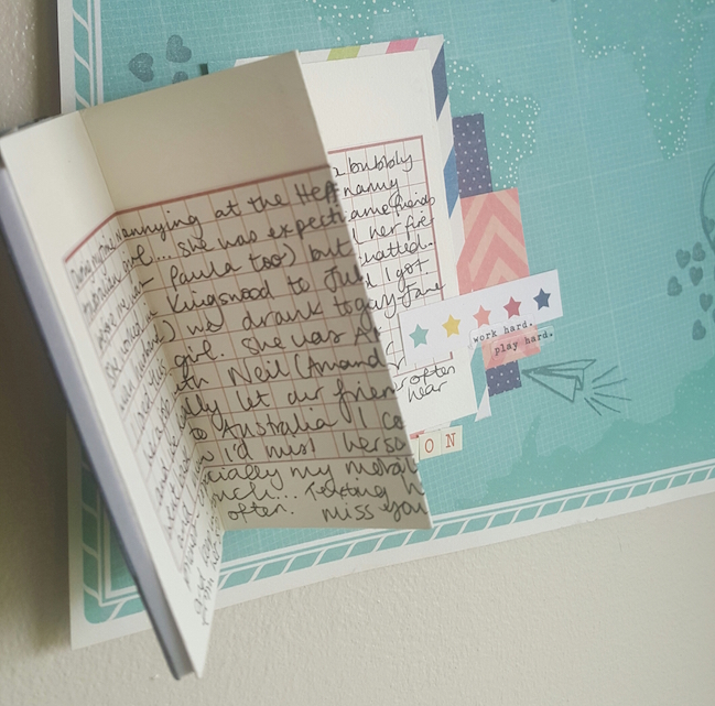 scrapbook with a folded journaling card // scrapbook page by Paula Brown
